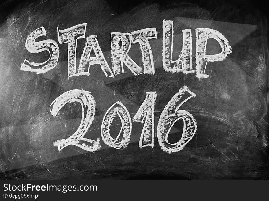 Startup 2016 in white chalk on blackboard.