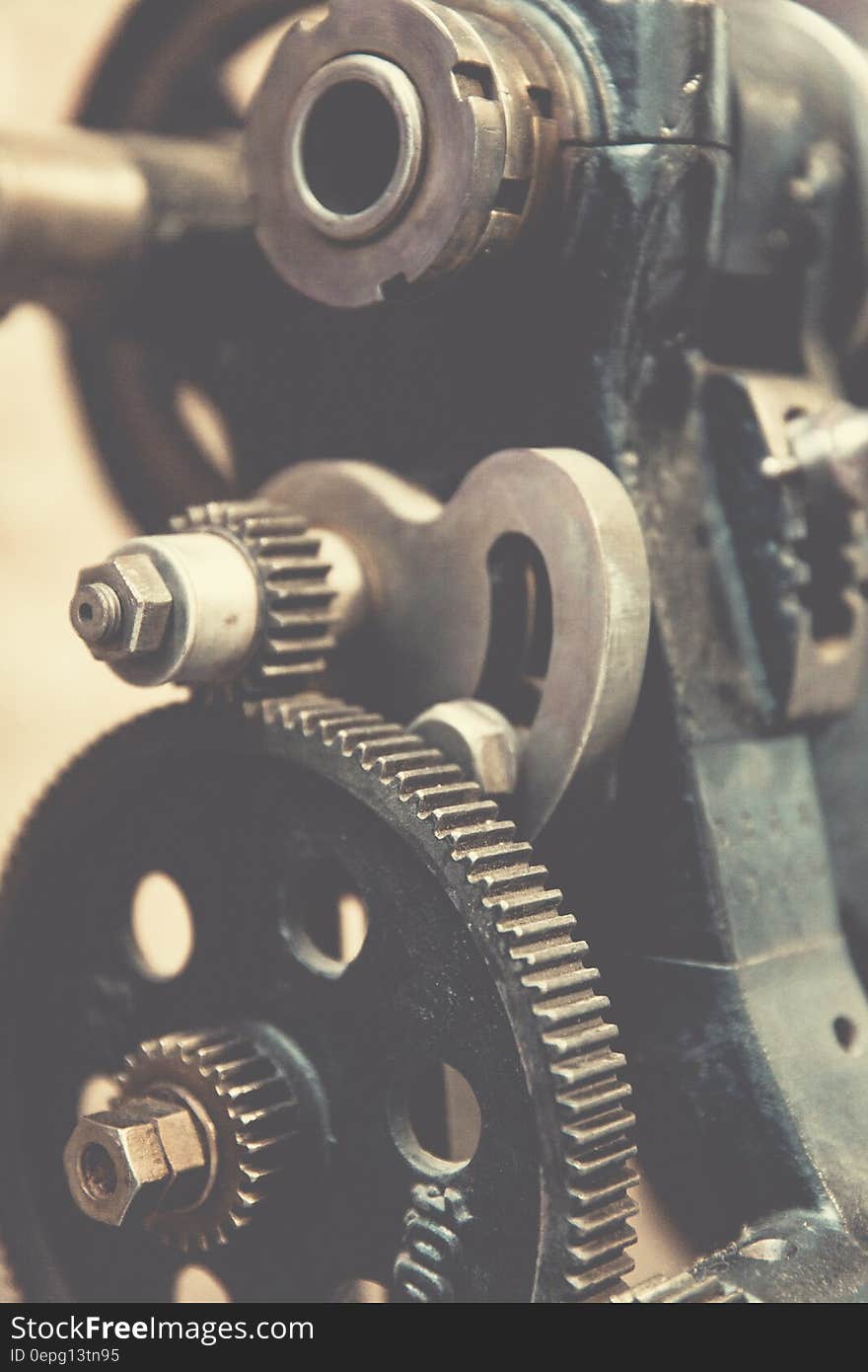 A close up of a machine with cogwheels and gears. A close up of a machine with cogwheels and gears.