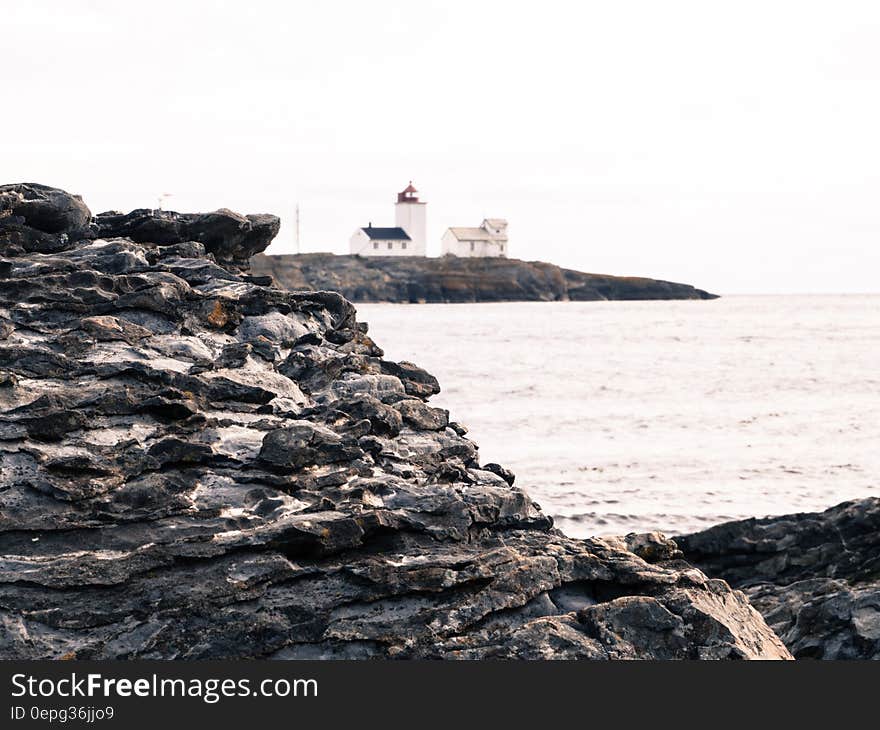 Gray Rock and House Near the Sea