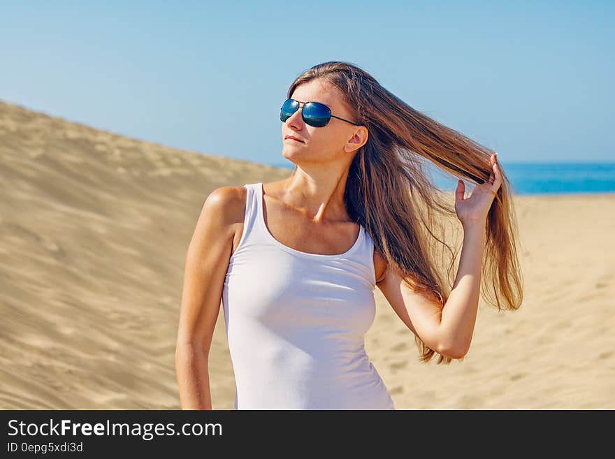 Woman Wearing Sunglasses at Beach