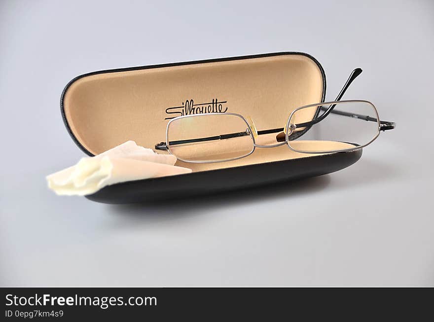 Silver Framed Eyeglasses on Black Eyewear Case