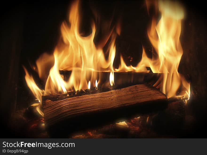 Close up of flames burning wood in fireplace. Close up of flames burning wood in fireplace.