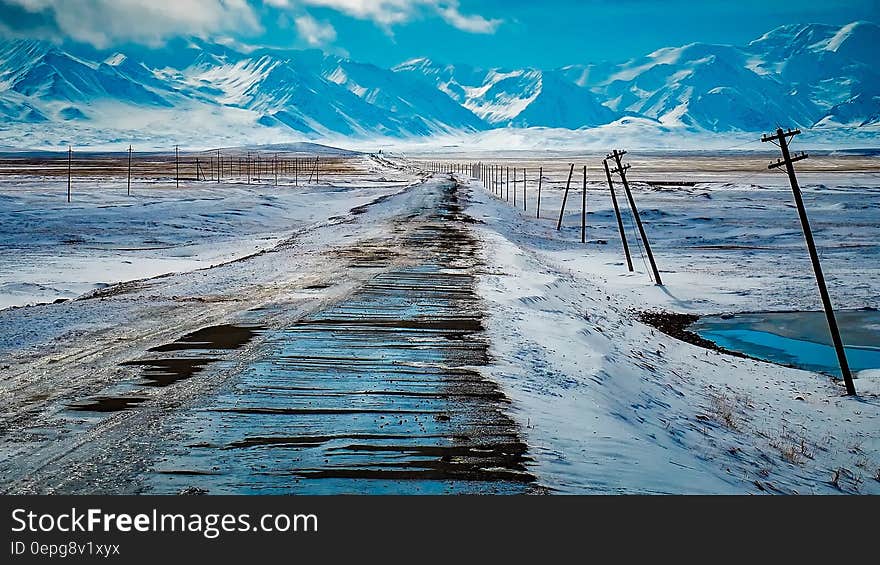 Scenic View of Snow Covered Mountains Against Sky