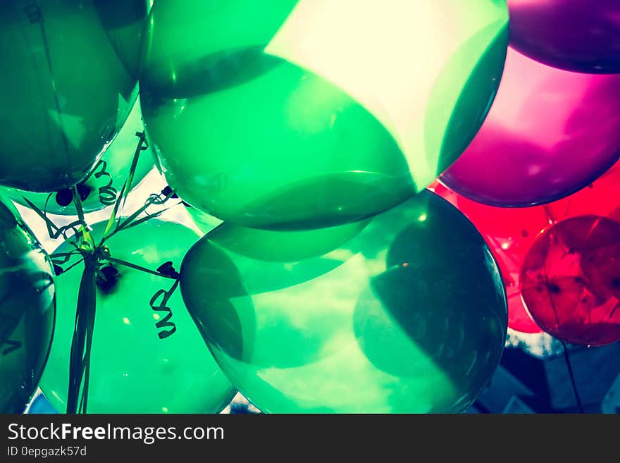 Landscape Photo Of Green and Red Balloons