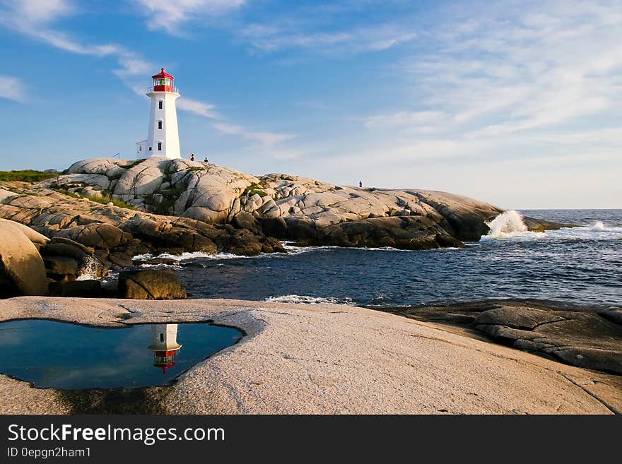 Lighthouse by Sea Against Sky