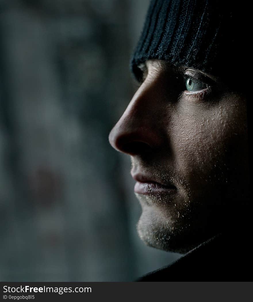 A portrait of a young man with a woolen hat. A portrait of a young man with a woolen hat.