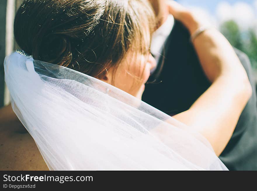 Bride Dancing With Groom in Black Suit Jacket