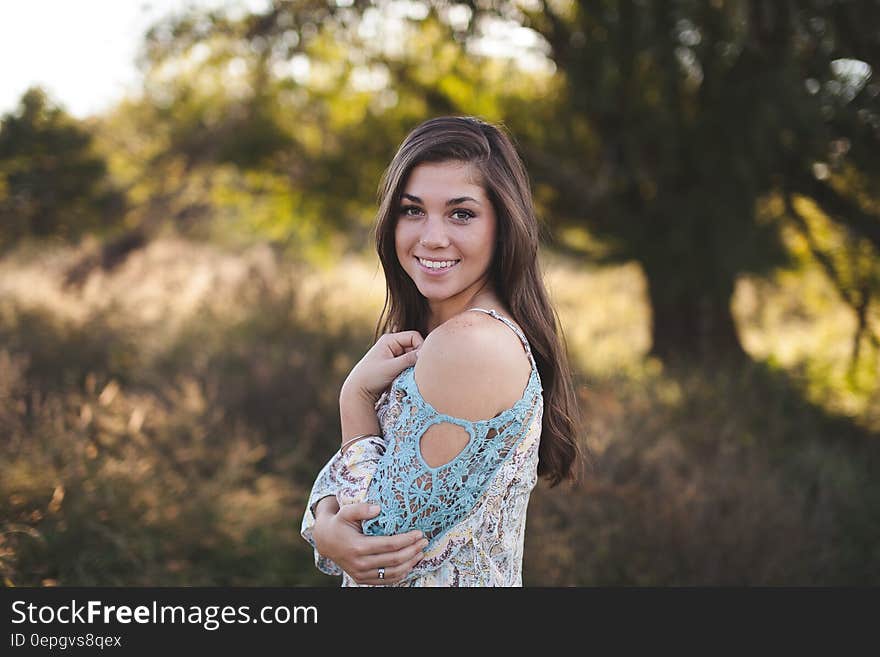 Woman in Blue White Cold Shoulder Shirt