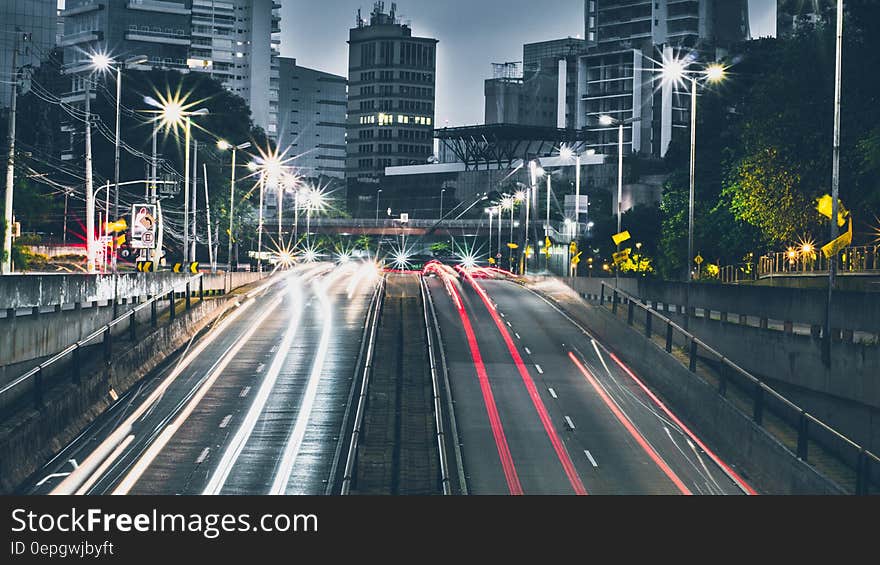 Blur of headlights and taillights on street of modern city illuminated at night. Blur of headlights and taillights on street of modern city illuminated at night.