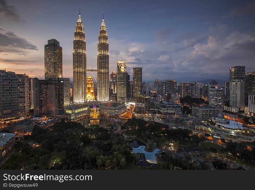 Twin towers and skyline of Kuala Lumpur, Malaysia illuminated at night. Twin towers and skyline of Kuala Lumpur, Malaysia illuminated at night.