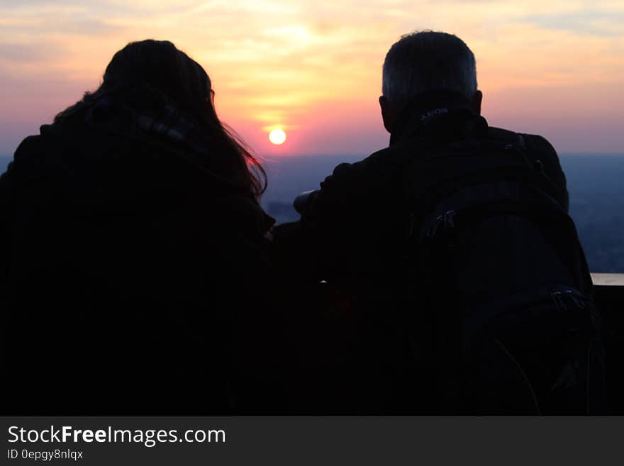 Two Silhouette Person Watching the Sunset