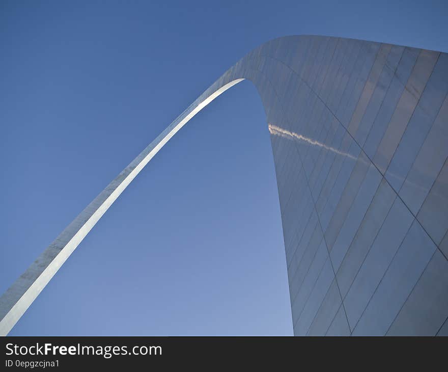 Facade of the St. Louis Arch in Missouri against blue skies on sunny day. Facade of the St. Louis Arch in Missouri against blue skies on sunny day.