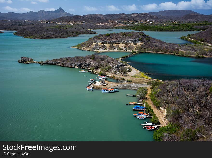 Aerial view of colorful boats in harbor along coastline of Curacao, Dutch Antilles on sunny day. Aerial view of colorful boats in harbor along coastline of Curacao, Dutch Antilles on sunny day.