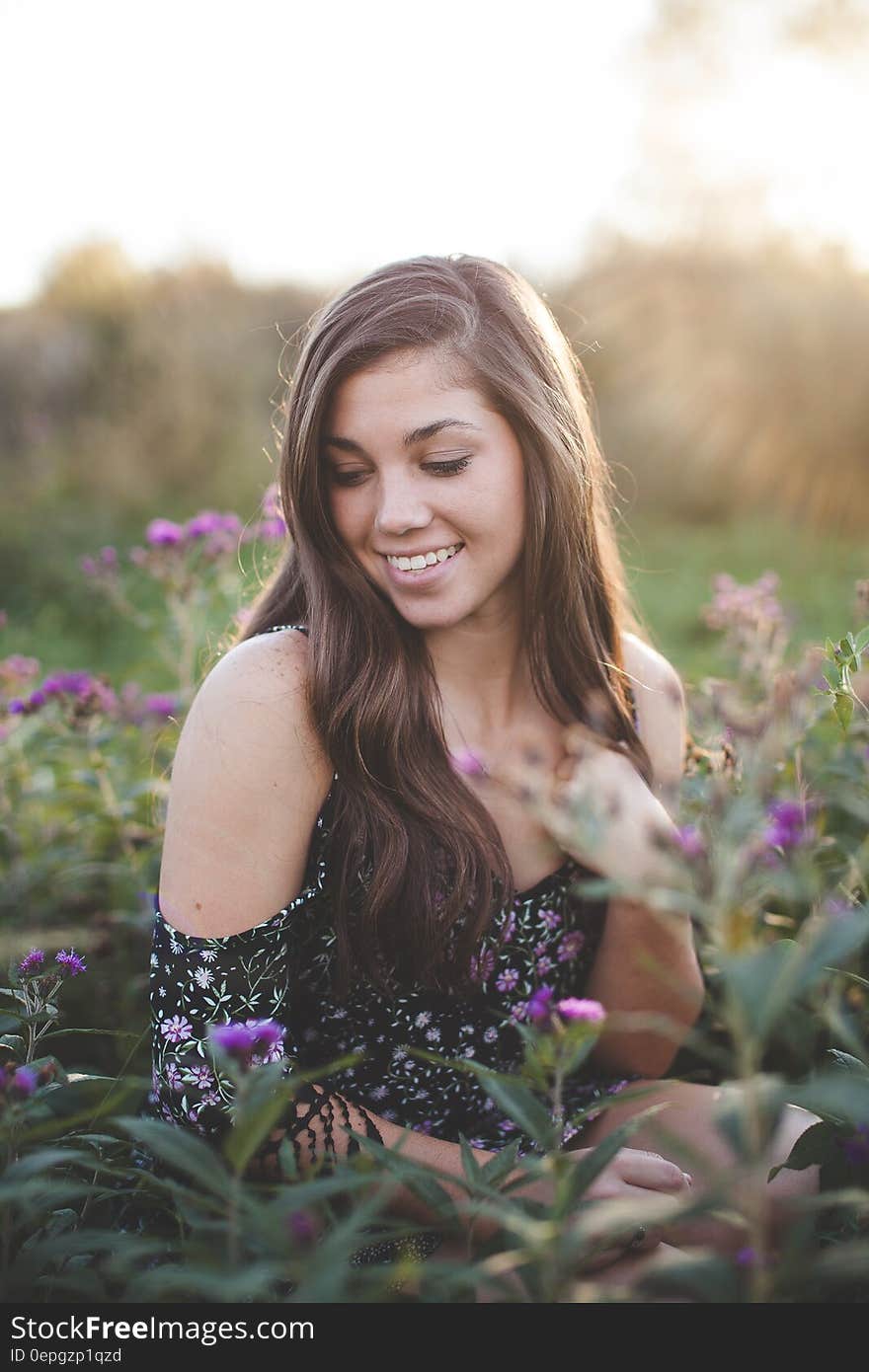 Selective Focus Woman Surrounded by Flower