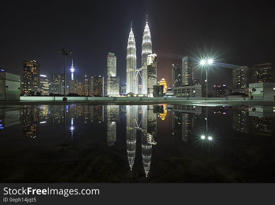 Skyline of Kuala Lumpur, Malaysia illuminated at night reflecting in waterfront. Skyline of Kuala Lumpur, Malaysia illuminated at night reflecting in waterfront.