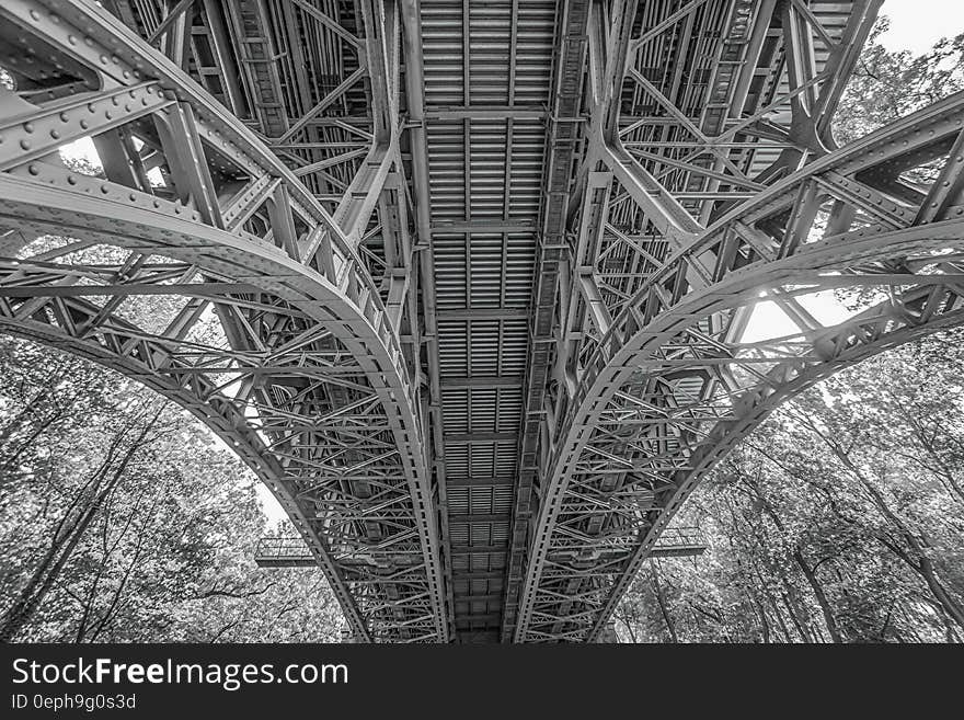 Under the Bridge Greyscale Low Angle Photograph