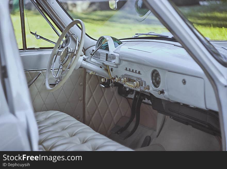 Interior of vintage automobile in grey leather. Interior of vintage automobile in grey leather.