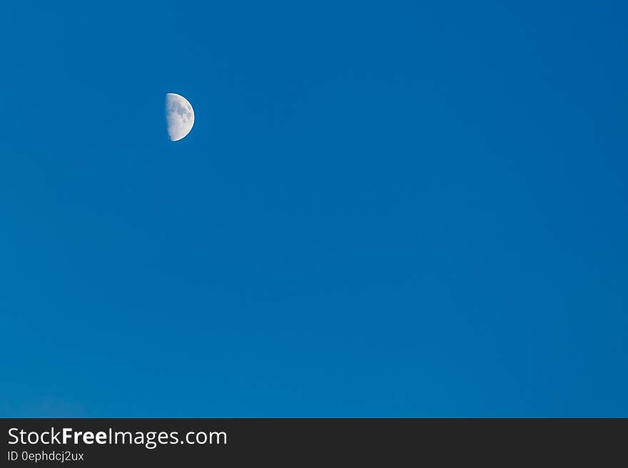 A half moon on the blue sky. A half moon on the blue sky.