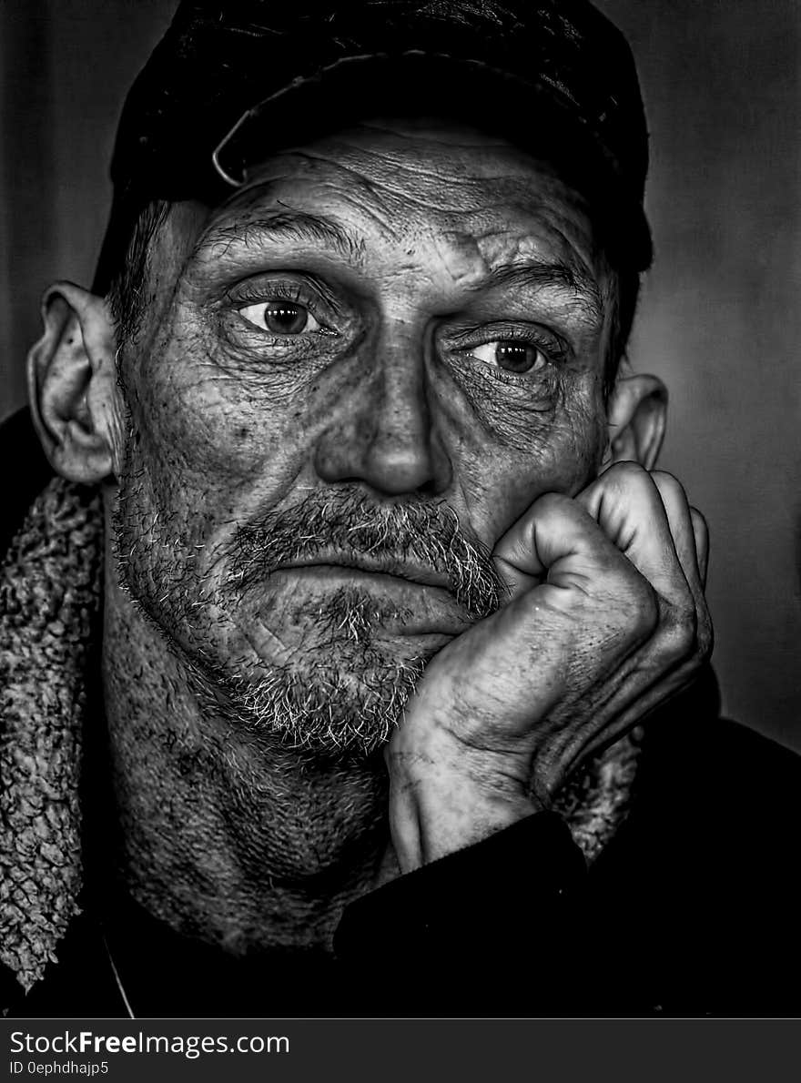 Man in Black Cap Grayscale Photo