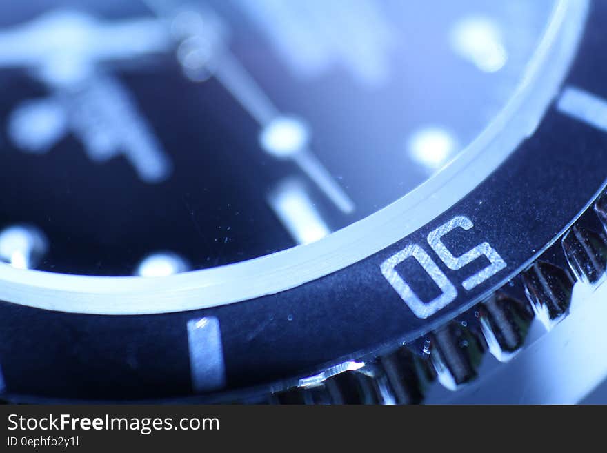 Close up of number and dial on a round watch. Close up of number and dial on a round watch.