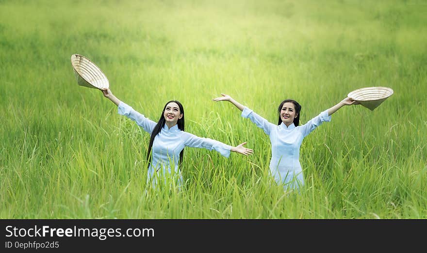 Young Woman Smiling in Grass