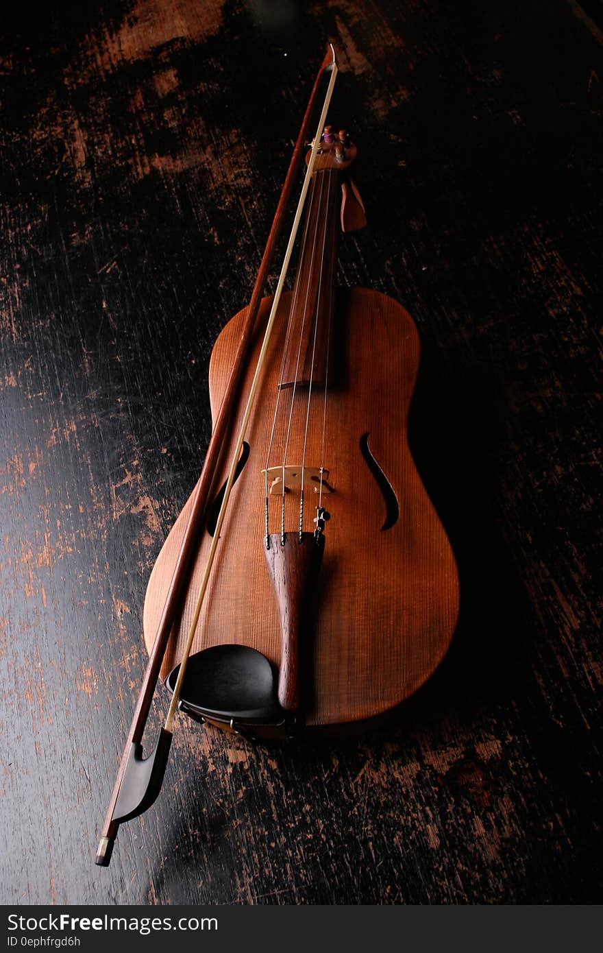 Brown Wooden Violin and Violin Bow