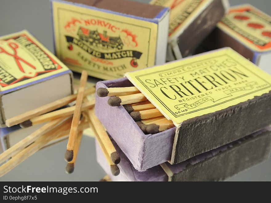 An open matchbox full of matches and a few closed ones beside. An open matchbox full of matches and a few closed ones beside.