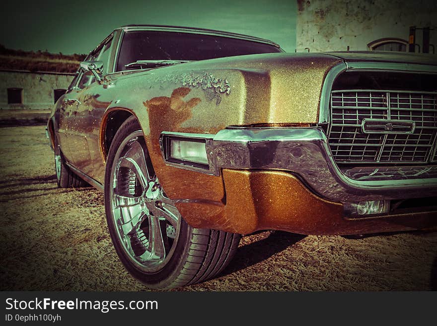 A close up of a 1968 Ford Thunderbird with focus on the front grill.