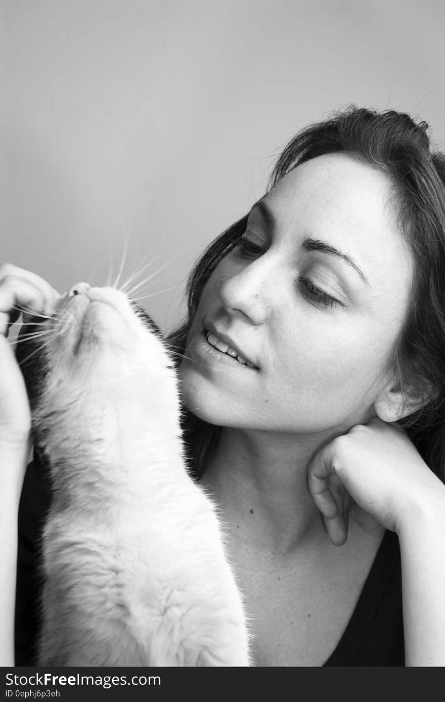 Grayscale Photo of Woman and Cat