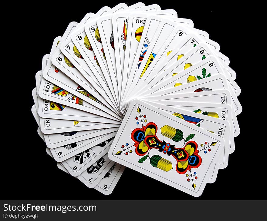 White and Yellow Playing Cards