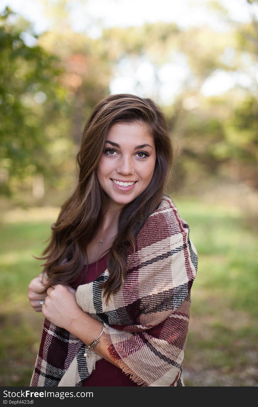 Brown Haired Woman Wearing Burberry Scarf