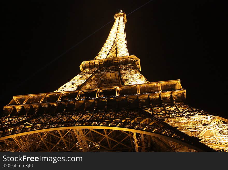 Eiffel Tower illuminated against night skies in Paris, France. Eiffel Tower illuminated against night skies in Paris, France.