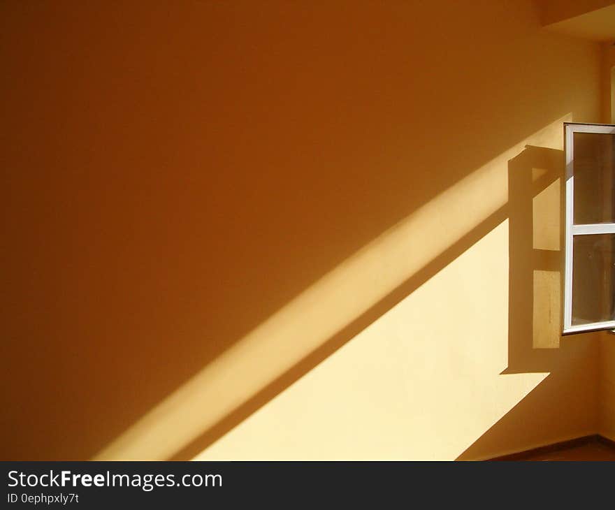 Sunlight through window of wall inside room. Sunlight through window of wall inside room