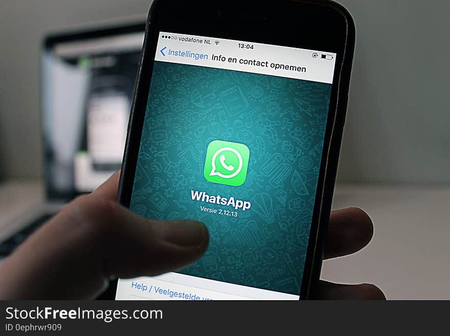 Apple iPhone screen running WhatsApp application.