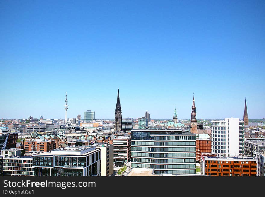 Roof tops of Hamburg, Germany in aerial skyline against blue skies. Roof tops of Hamburg, Germany in aerial skyline against blue skies.