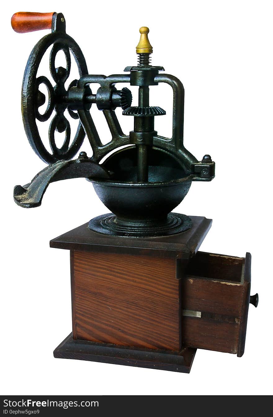 An old fashioned coffee grinder on a white background.