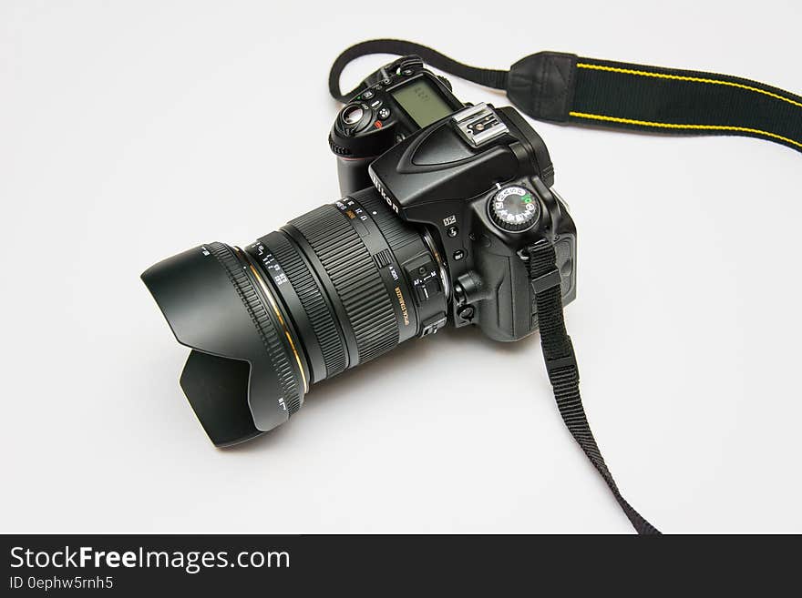 Black Dslr Camera on White Surface