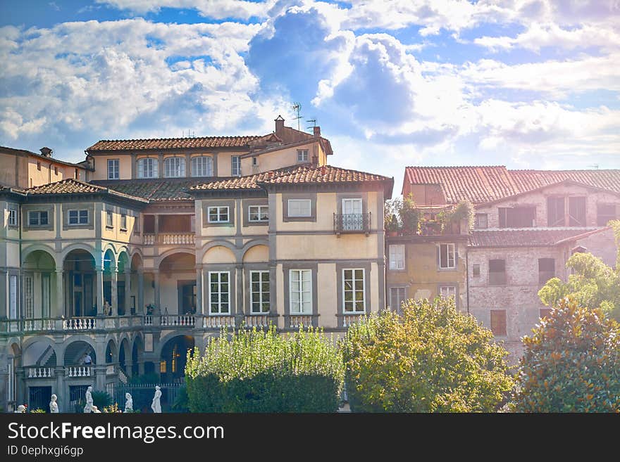 Exterior of houses in Italian village against blue skies on sunny day. Exterior of houses in Italian village against blue skies on sunny day.