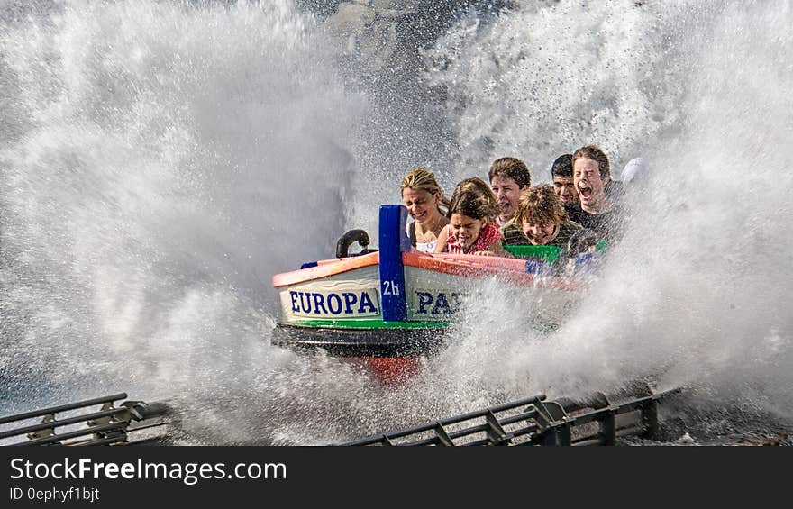 Children smiling, laughing and screaming with joy on a water park roller coaster ride. Children smiling, laughing and screaming with joy on a water park roller coaster ride.