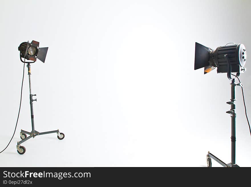 2 Black and Brown Studio Lighting in White Room