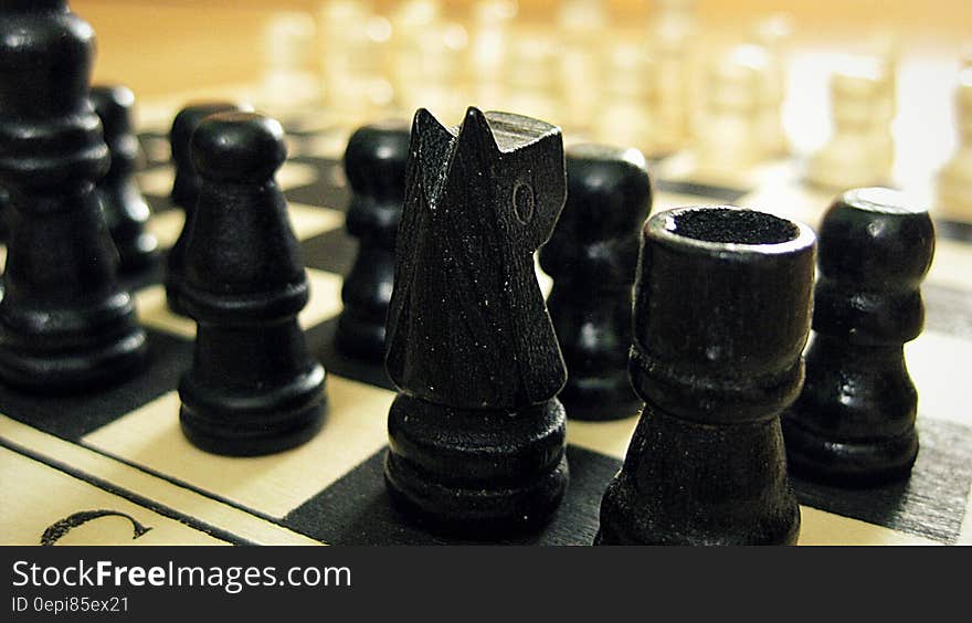 Black Chess Pieces on Chess Board