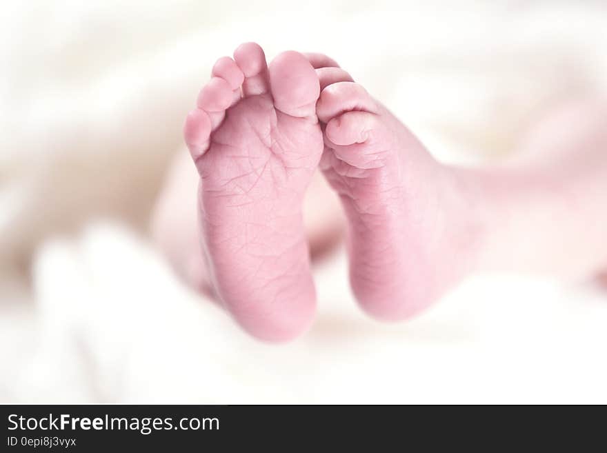 Baby&#x27;s Foot on White Textile