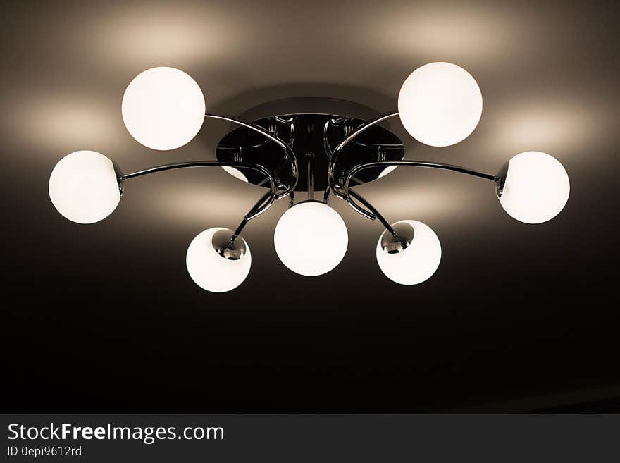 Silver Flush Mount Ceiling Light With Seven White Globe Lights