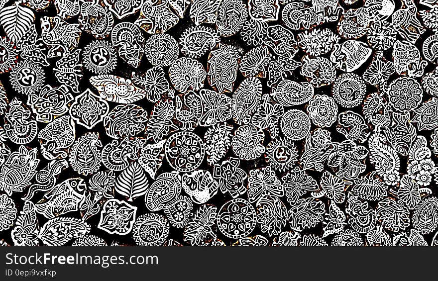 Background of tiny historic patterned artistic objects created in white on black. Background of tiny historic patterned artistic objects created in white on black.