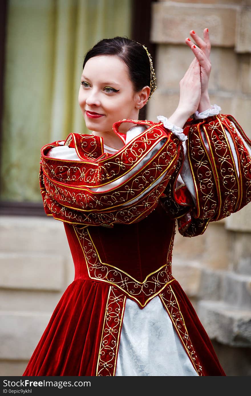 Woman in Red White Dress Clapping in Daytime