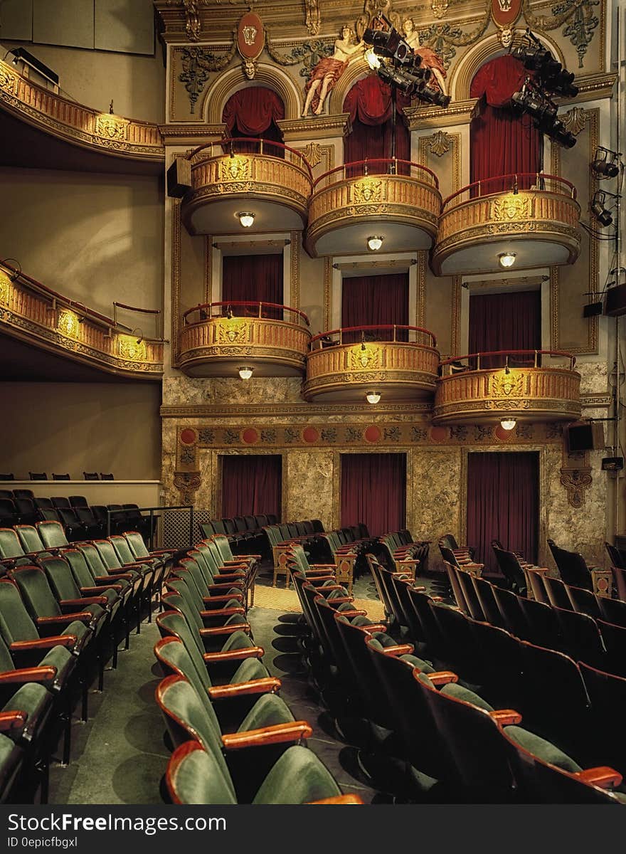 Elegant balconies and empty seats inside a theater. Elegant balconies and empty seats inside a theater.