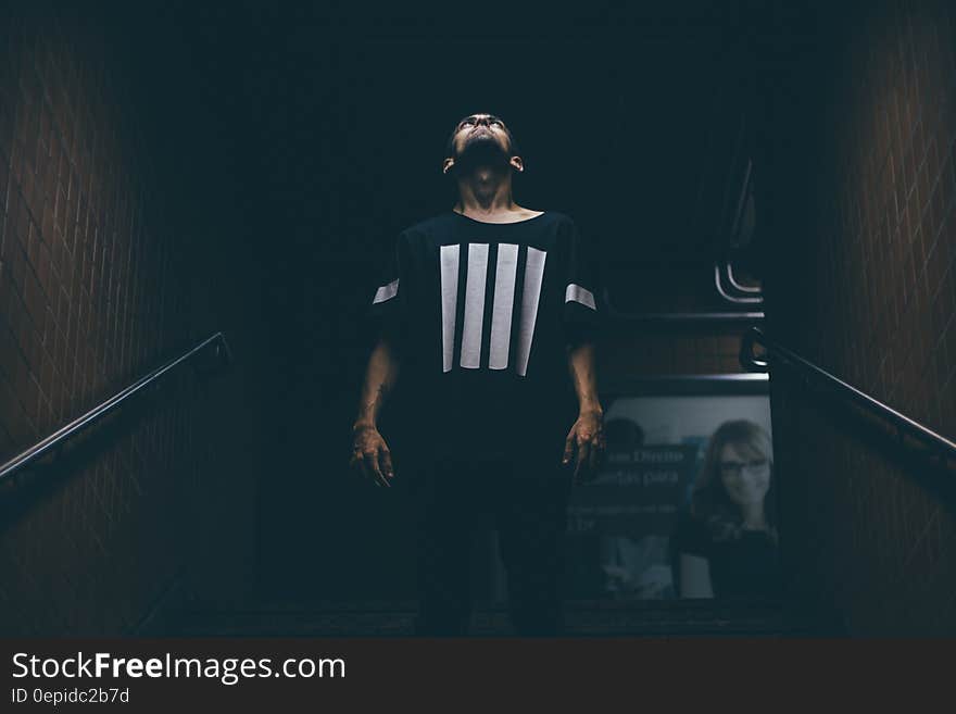 Man Standing on Stair Case Looking Up