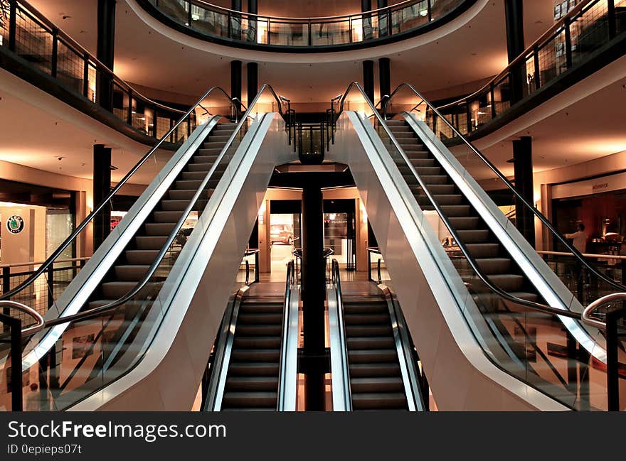 Atrium and escalators in a shopping center or mall. Atrium and escalators in a shopping center or mall.