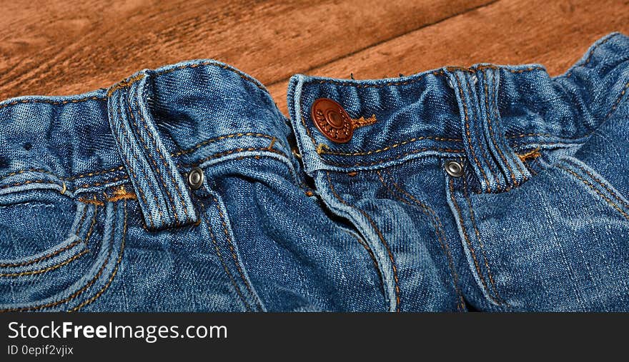 Brown Button on Blue Denim Bottom