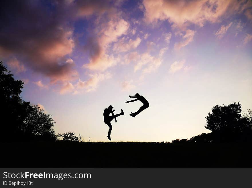 2 People Doing Karate during Sunset